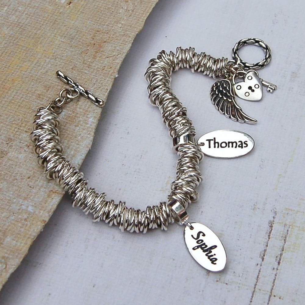 Stunning sterling silver bracelet with personalised name charms and ...