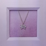Suz Angel Wings with Heart Necklace in frame